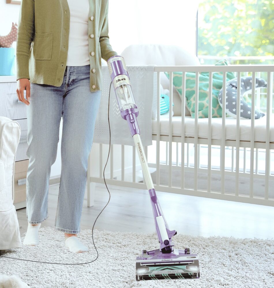 mom vacuuming a nursery after learning how to choose the best vacuum in edmonton