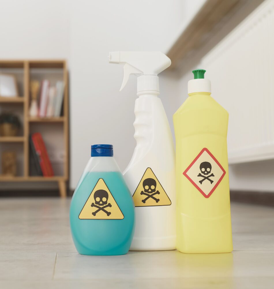 bottles of toxic fragranced cleaning products on a kitchen floor